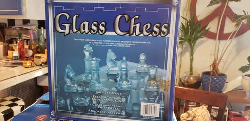 Glass chess set with instructions on how to play chess