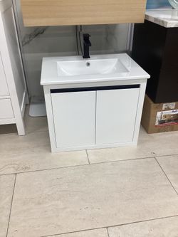 24” vanity, floating/wall mounted, ceramic top, available for pick up