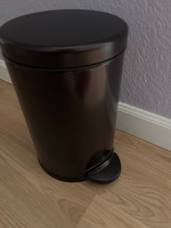 Small black step trash can