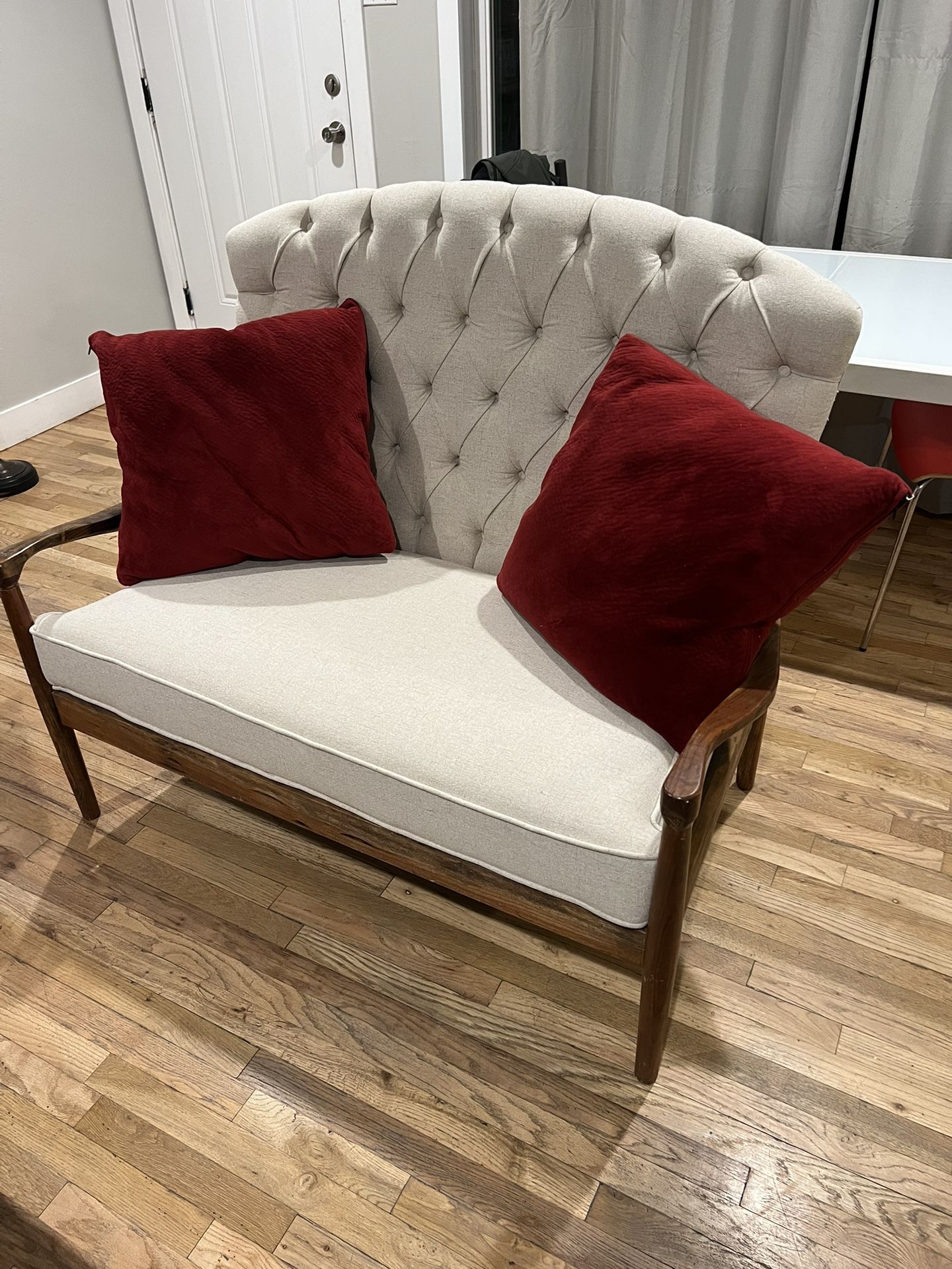 Oak couch with feather pillows