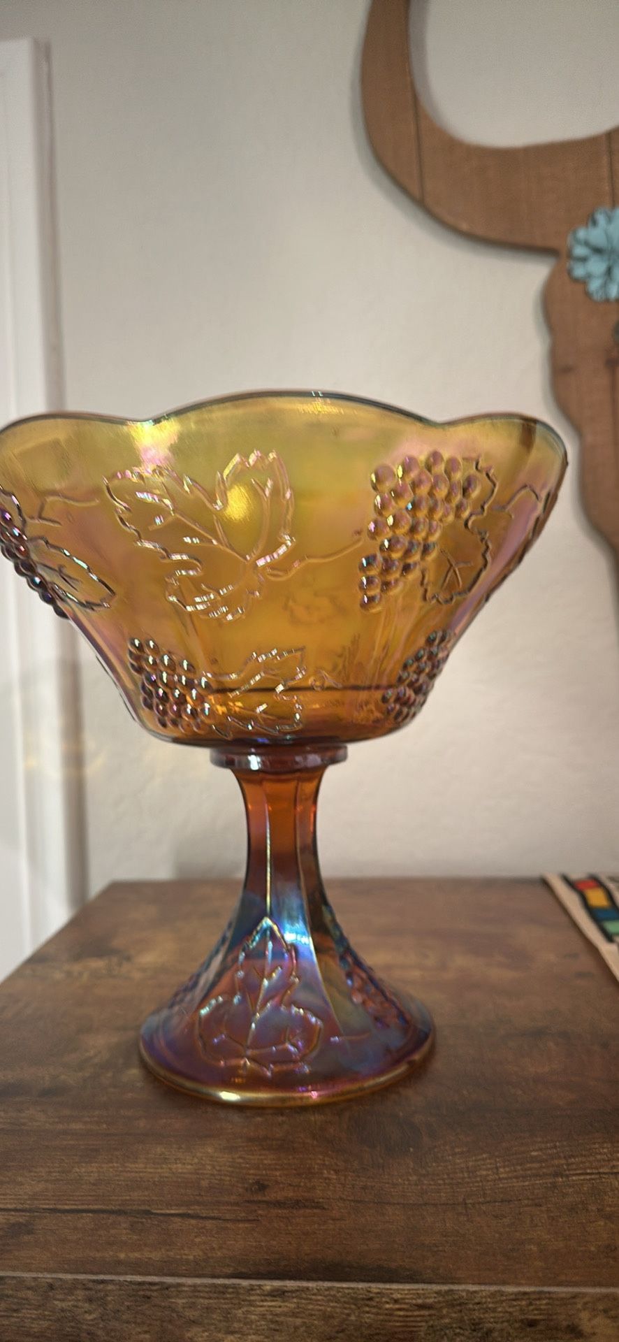Vintage Indiana Glass Harvest pattern bowl in amber carnival glass.
