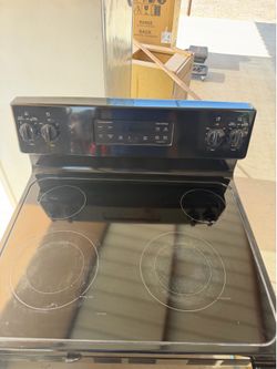 All black GE appliances microwave dishwasher and electric stove