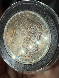 1884-o LOTS of toning Morgan dollar