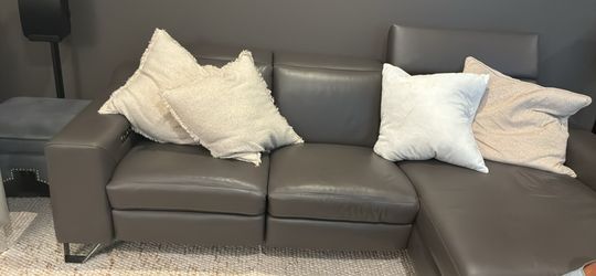 Perfect leather sectional with motorized feet recliner and head rests!