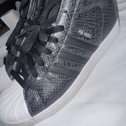 Black and white high top Adidas size 11