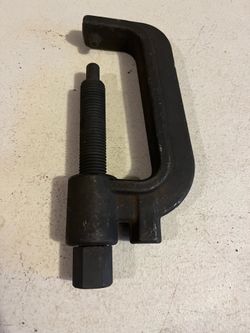 Torsion bar unloading tool for gm ford dodge