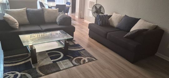 2 2seater sofa, with centre table and centre rug
