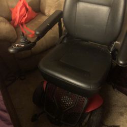 black and red power chair 