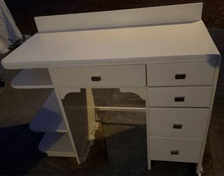 Desk with drawers and side shelving