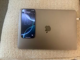 iPhone 16 pro and MacBook Pro with touchpad