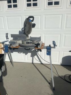 Miter saw with laser and table