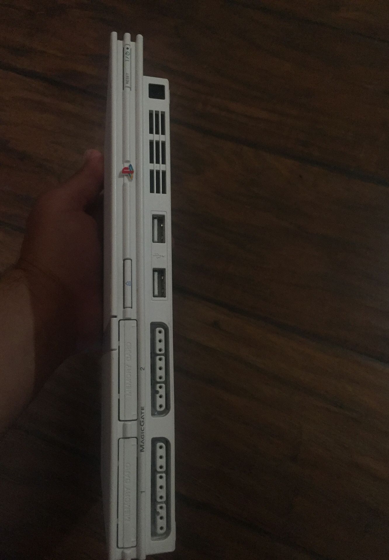 white PlayStation 2 Slim