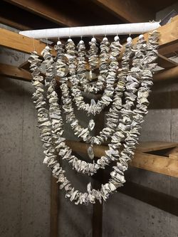 handcrafted coastal-style garland / chandelier made from natural oyster shells