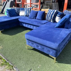 Blue sectional sofa with pillows