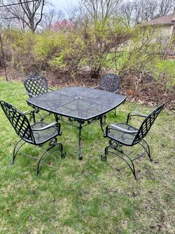 1950’s vintage wrought iron patio set, table and 3 chairs, size is 41x41, delivery available for extra cost