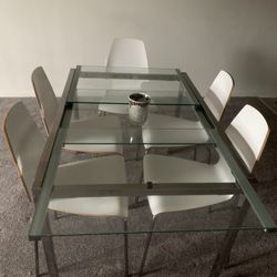 Six chairs and dining room glass table in great condition
