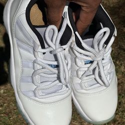 4y this product is the Nike Air Jordan 11 Retro Low 'Legend Blue', featuring a white patent leather upper and an icy blue