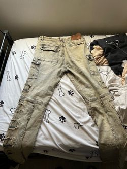 Beige stacked ripped jeans