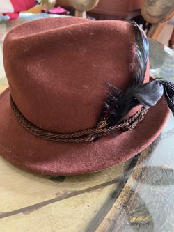 100% wool Italian on size fit all rust brown hat with black feather Filippo Cartarzi 100% Wool Italian one size fit all rust brown hat with