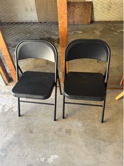 2 metal folding chairs