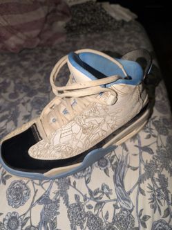 These are Nike Air Jordan Dub Zero shoes in the White/University Blue-Black "UNC" colorwa