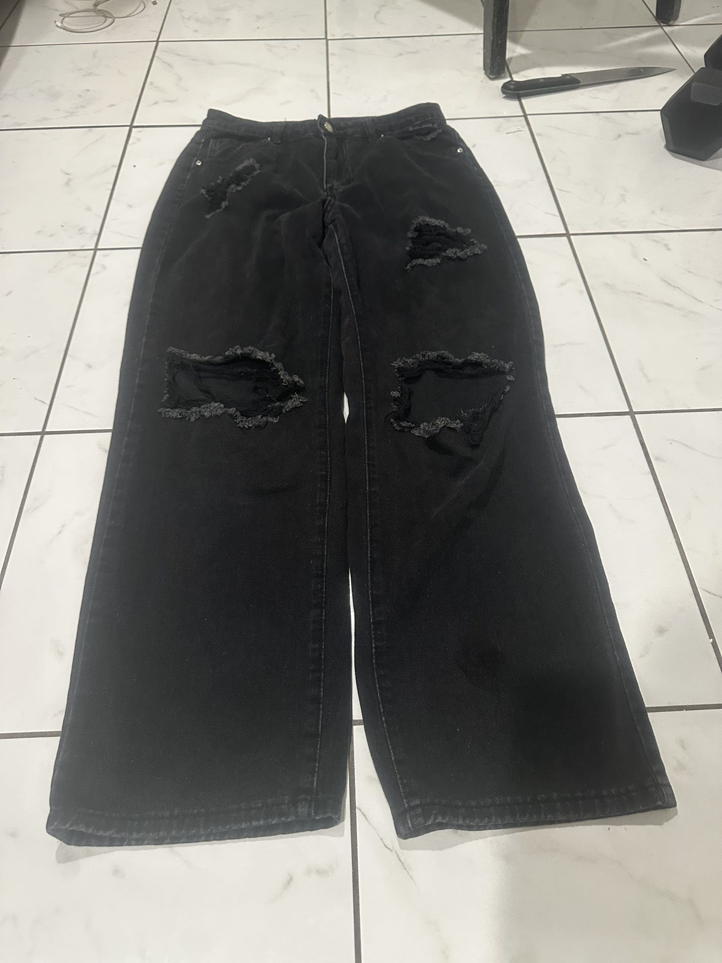 Woman’s Distressed Black Denim Jeans
