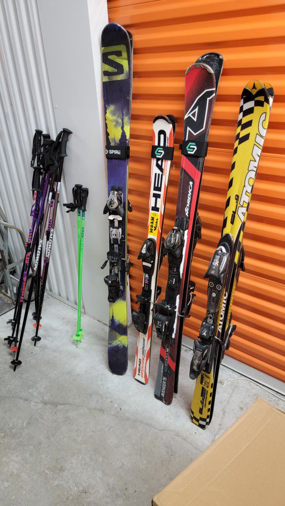 Skis,poles,and 3 Snowboogies