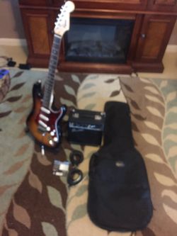 Electric Guitar,Speaker,Bag,Stand,Extra String, and two connection