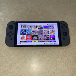 NINTENDO SWITCH OLED + 100 SWITCH GAMES and Over 7000 CLASSIC GAMES