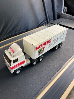 1980s vintage ERTL Sathers Candy Co. pressed steel semi-truck and trailer