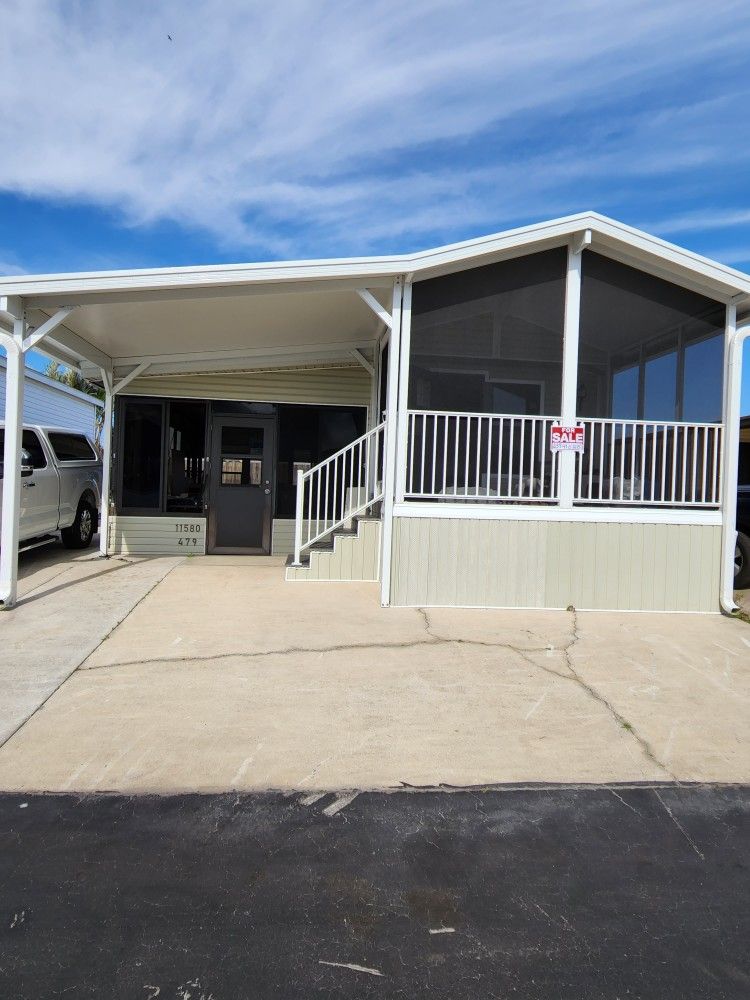 MANUFACTURED HOME AND PERIMETER LOT IN HOLIDAY CONDO PARK (16410 SAN CARLOS BLVD.)