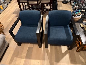 two navy blue chairs with black frame