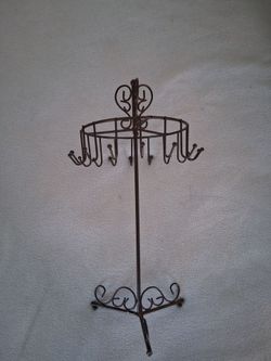 Vintage black metal spinning top jewelry holder