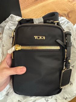 Brand new black Tumi crossbody bag with tags and gift wrapping