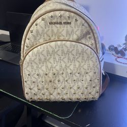 Tan mini mk bookbag with gold gems 