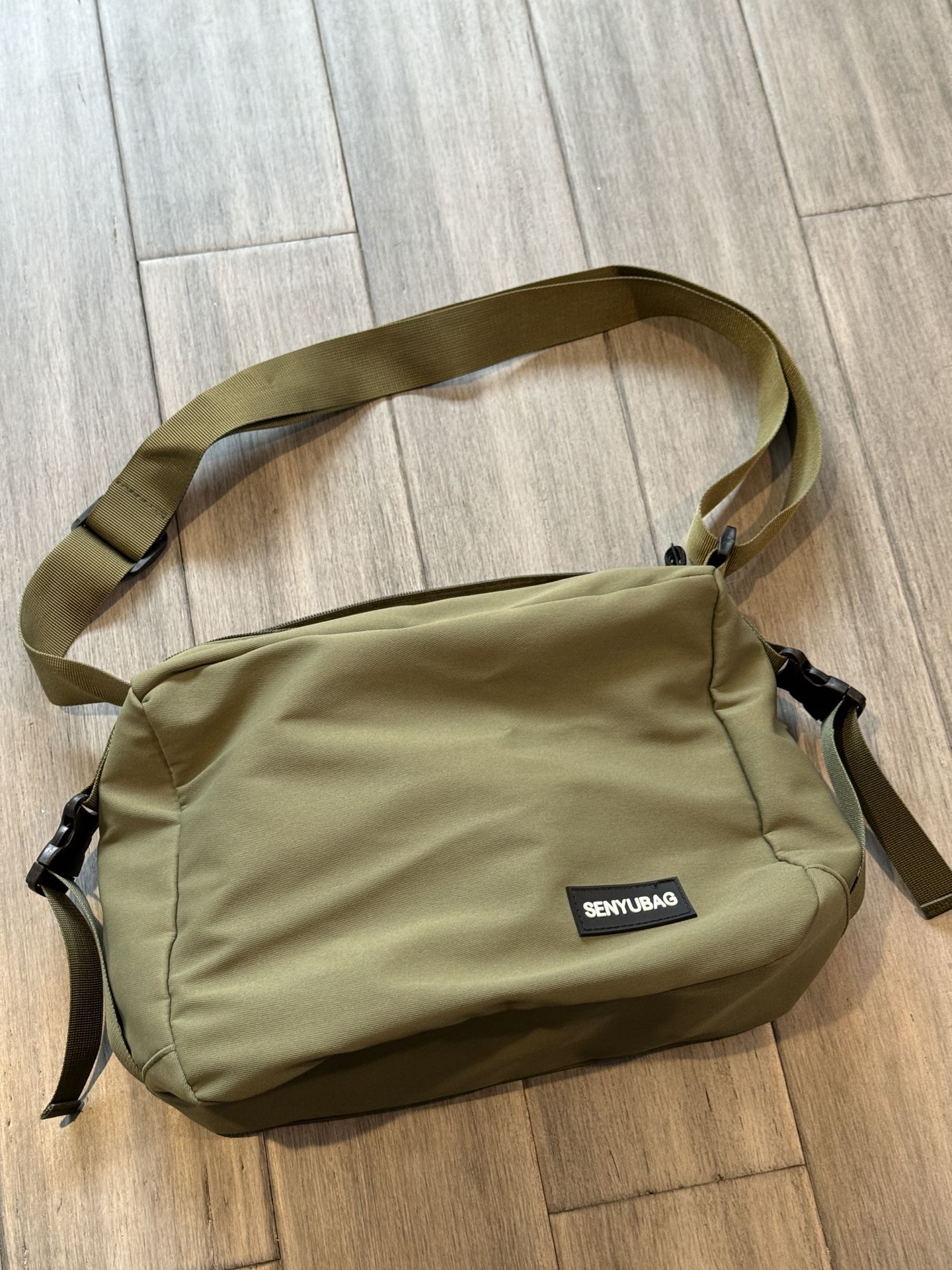 brand new bag, water resistant, olive color, original $30