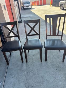 3 brown chairs