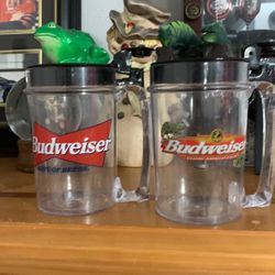 Two Budweiser mugs, frog and lizard talking $30 can be shipped for six dollars