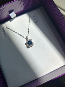 5MM Round Blue Topaz and White Sapphire Birthstone Flower Halo Pendant in Sterling Silver