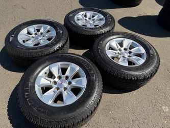17 inch stock gmc sierra rims And Yokohama AT tires for sale 6 lug 65-70% tread