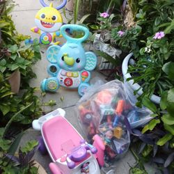 PUSH TOYS AND A BAG OF TOYS.