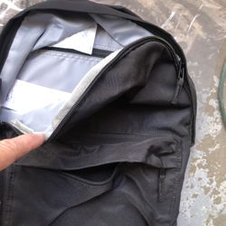 Backpack, NEW Amazon Basics.  Lots Of Pockets.  Cheap!