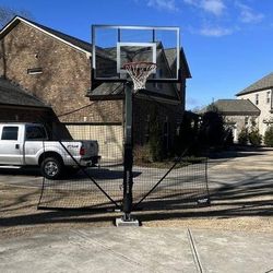 Goaliath 54 inch in ground basketball hoop, adjustable basketball court