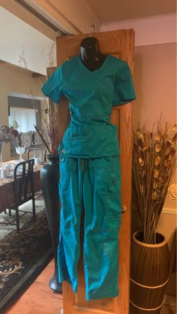 2 sets & 2 pair of pants of Brand new pink scrub set gray pant brand new & red pants brand new and other outfit used but in excellent condition.