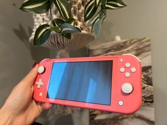 Nintendo Switch Lite in Coral - with Animal Crossing