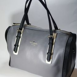 The Kate Spade Bedford Square leather handbag, the strap is missing is a stylish and versatile accessory for women. Made of high-quality leather with 