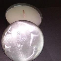 NEW CANDLE IN METAL CONTAINER, LID WITH HALF MOON ON TOP