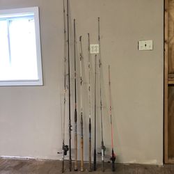 Eight Fishing Rods, Three With Reals And Extra Hooks And Weights