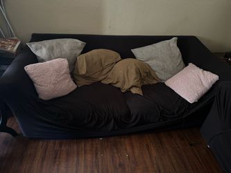 Two large couches in good condition with cover