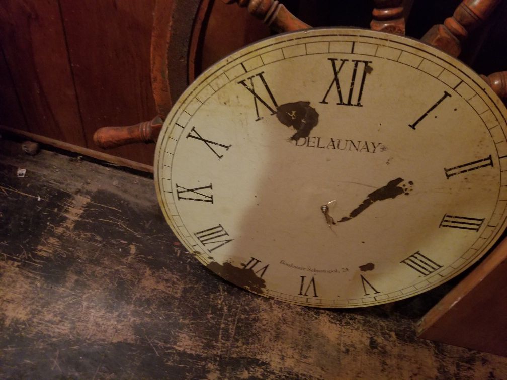 Clock face looks antique.
